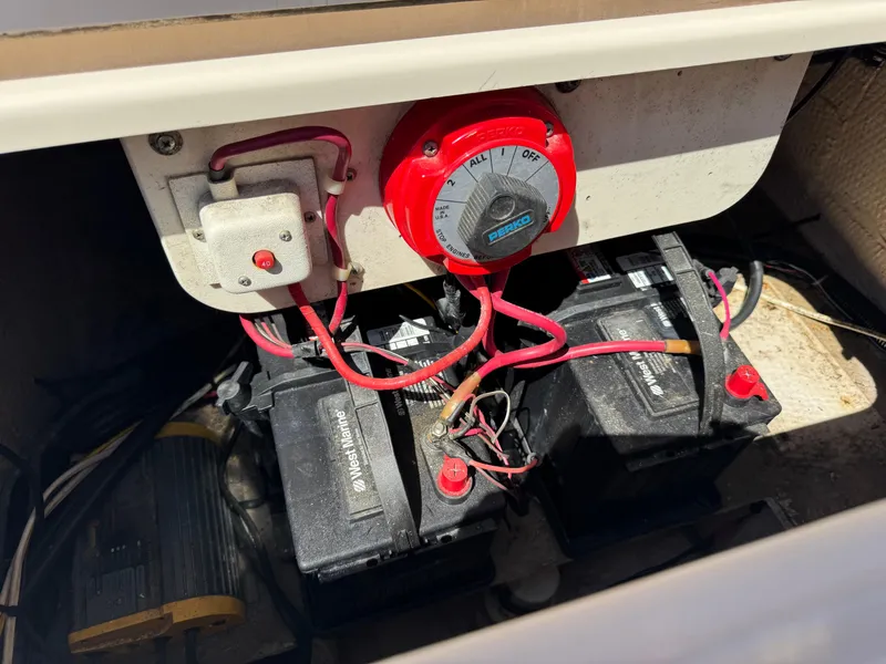 Slide: The Image of Battery compartment of a 1996 Grady-White Voyager 248 boat with wiring and switch. - 8