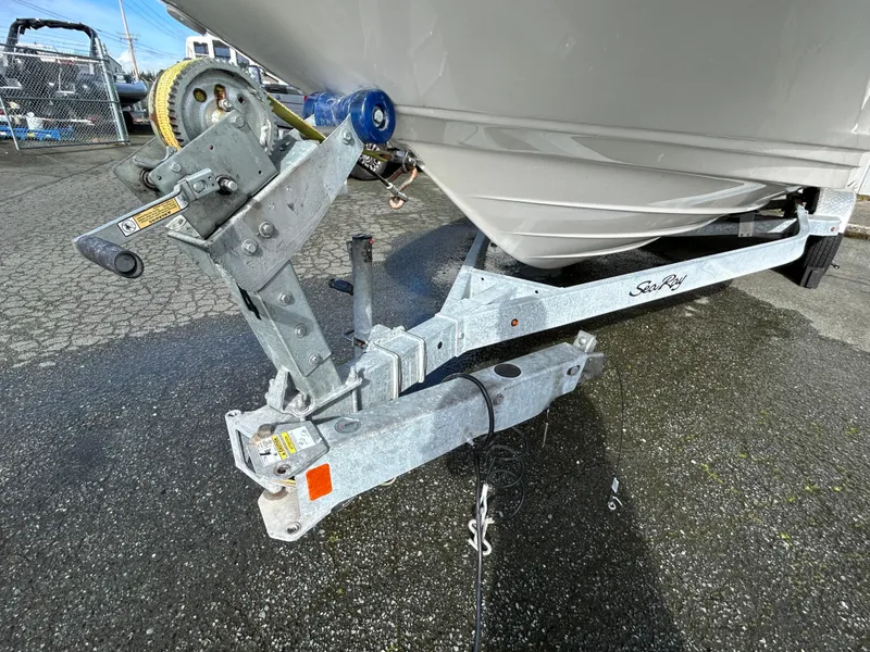 Slide: The Image of 2021 Sea Ray SPX 210 OB boat trailer hitch on wet pavement. - 12