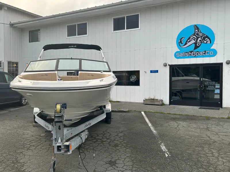 Slide: The Image of 2021 Sea Ray SPX 210 OB boat on trailer outside Salish Boat Co. building. - 2