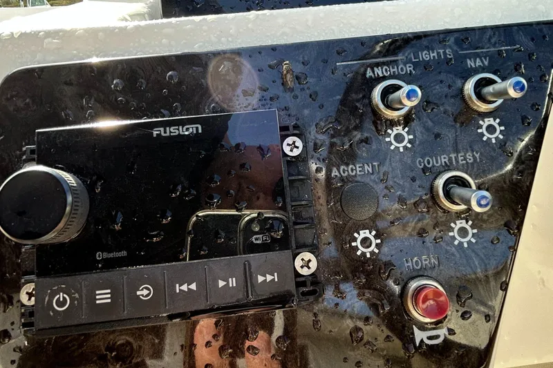 Slide: The Image of Control panel of 2021 Sea Ray SPX 210 OB boat with Fusion audio system. - 4