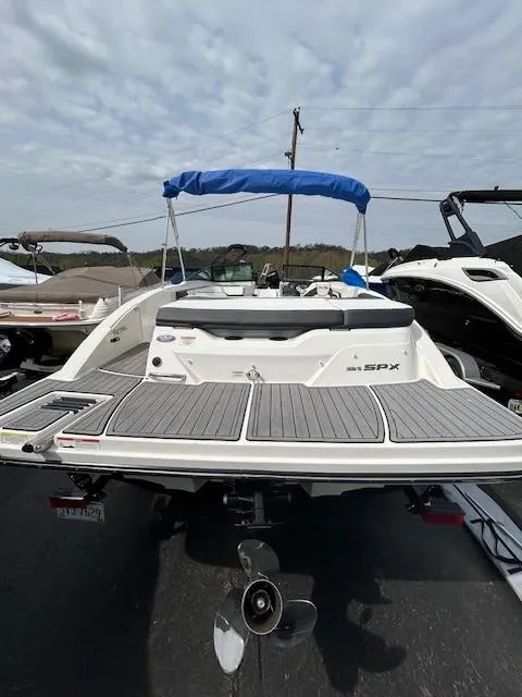 Slide: The Image of 2015 Sea Ray 21 SPX boat with blue canopy and spacious deck. - 5
