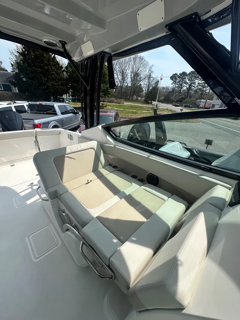 Slide: The Image of 2025 Boston Whaler 280 Vantage interior with comfortable seating and sleek design. - 12