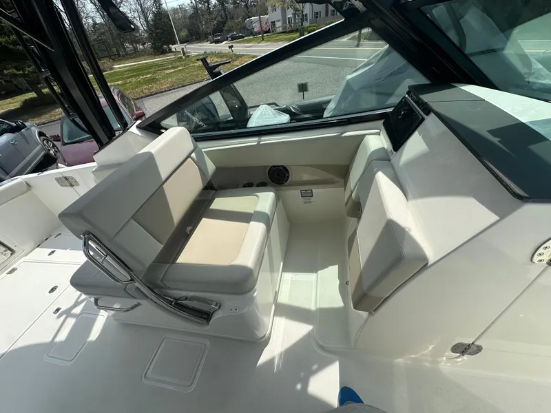 Slide: The Image of 2025 Boston Whaler 280 Vantage boat interior with seating and dashboard view. - 18