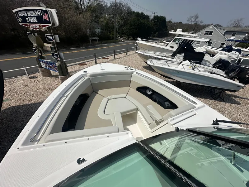 Slide: The Image of 2025 Boston Whaler 280 Vantage boat with spacious bow seating, displayed outdoors. - 21