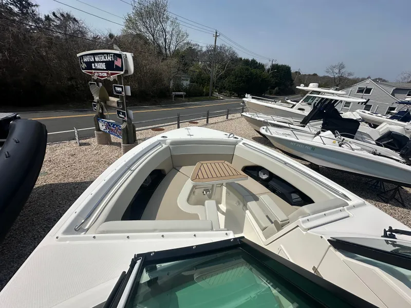 Slide: The Image of 2025 Boston Whaler 280 Vantage boat on display at a dealership. - 22