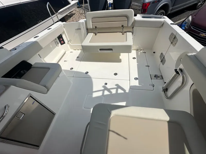 Slide: The Image of 2025 Boston Whaler 280 Vantage boat interior with seating and storage compartments. - 5