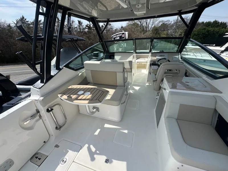 Slide: The Image of 2025 Boston Whaler 280 Vantage boat interior with seating and table, showcasing luxury design. - 8