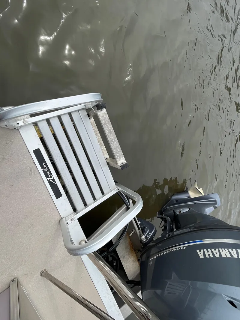 Slide: The Image of Avalon CATALINA 22 boat with Yamaha motor, 2014 model, docked by water. - 14