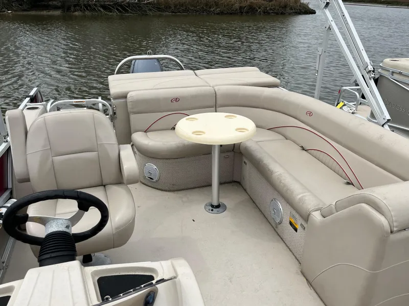 Slide: The Image of Avalon CATALINA 22 boat interior, 2014 model, featuring beige seating and a central table. - 19