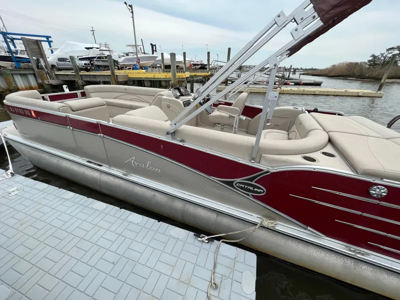 Slide: The Image of 2014 Avalon CATALINA 22 pontoon boat docked at marina. - 2