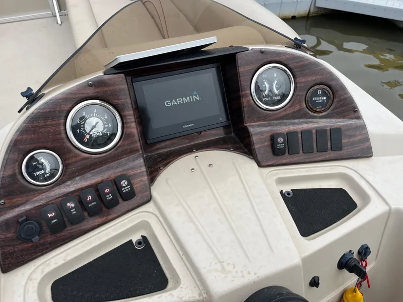 Slide: The Image of Dashboard of 2014 Avalon CATALINA 22 with Garmin display and wood finish. - 9