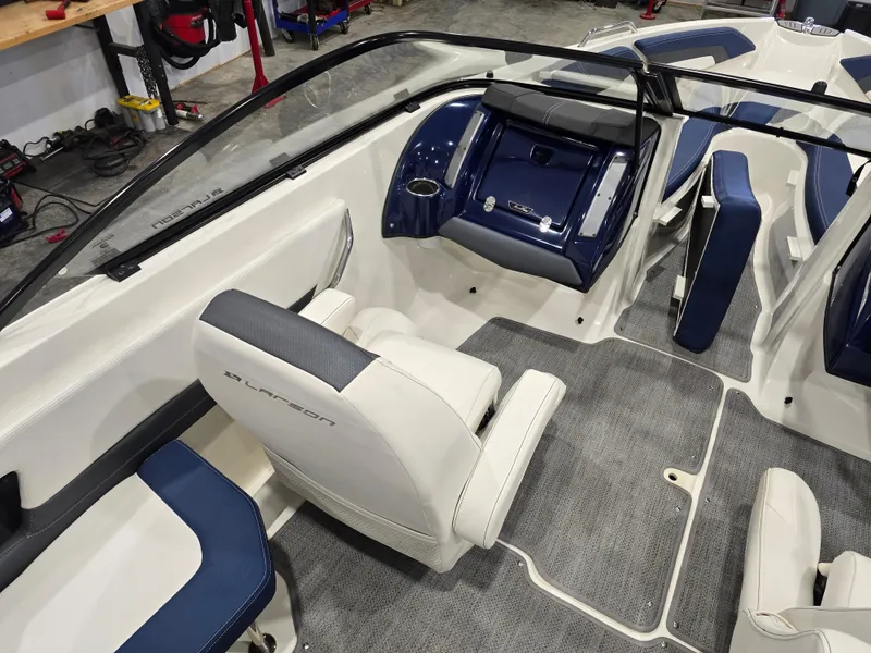 Slide: The Image of Interior of a 2019 Larson LX 225 IO boat with blue and white seating. - 34