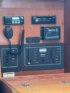 Slide: The Image of Control panel of a 2000 Beneteau Oceanis 311 sailboat with radio and navigation equipment. - 26