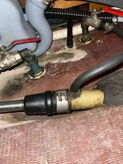 Slide: The Image of Plumbing and hoses in a 2000 Beneteau Oceanis 311 sailboat. - 32