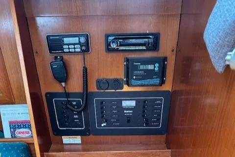 Slide: The Image of Control panel of a 2000 Beneteau Oceanis 311 sailboat with radio and navigation equipment. - 41