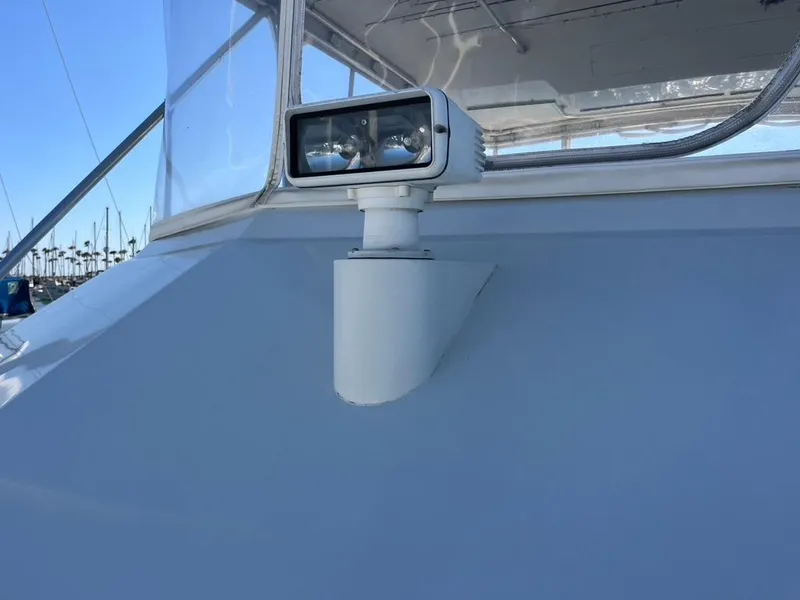 Slide: The Image of Spotlight on 1988 Hatteras 52 Convertible yacht, docked with clear blue sky. - 10