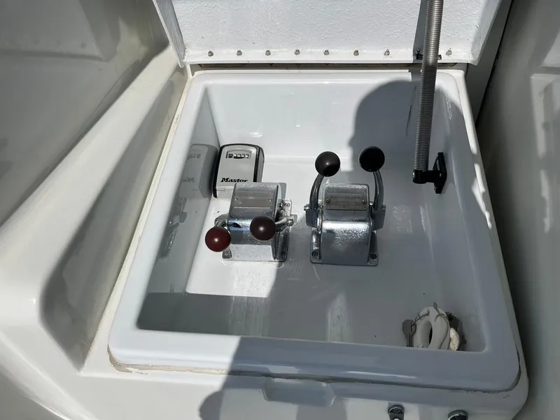 Slide: The Image of Control panel of 1988 Hatteras 52 Convertible yacht with levers and switches. - 14
