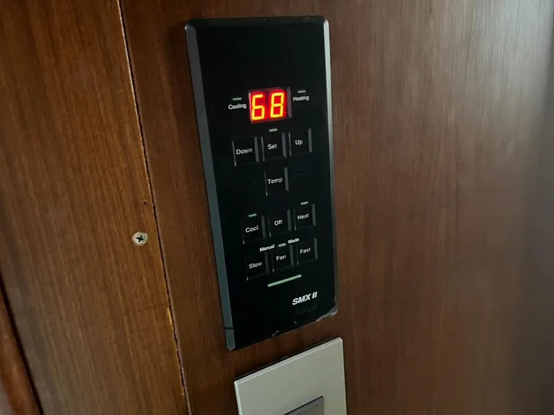 Slide: The Image of Thermostat control panel on 1988 Hatteras 52 Convertible yacht, displaying temperature setting. - 17