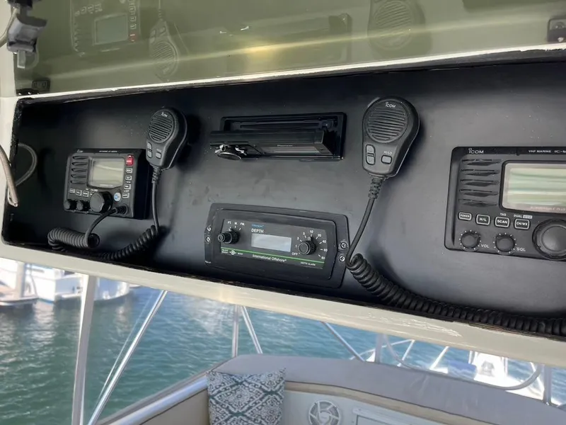 Slide: The Image of Control panel of a 1988 Hatteras 52 Convertible yacht with communication equipment. - 38