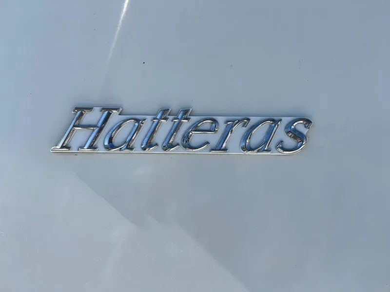 Slide: The Image of Chrome "Hatteras" logo on a 1988 Hatteras 52 Convertible yacht. - 4
