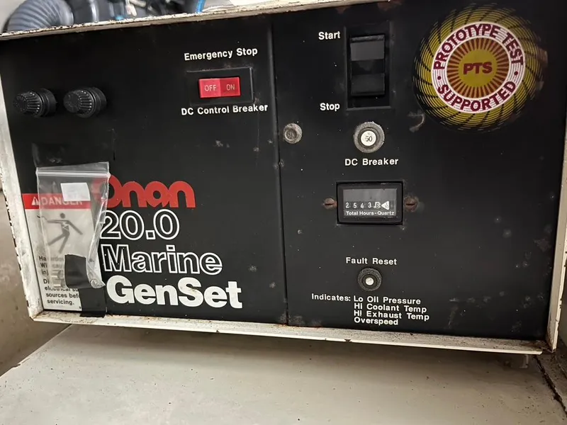 Slide: The Image of Onan 20.0 Marine GenSet control panel on a 1988 Hatteras 52 Convertible. - 43
