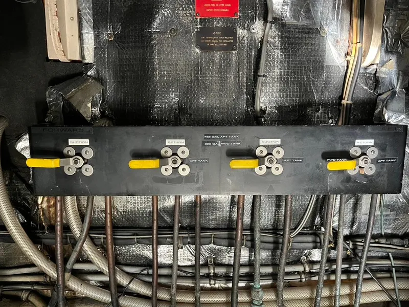 Slide: The Image of Control panel with yellow levers on a 1988 Hatteras 52 Convertible yacht. - 49