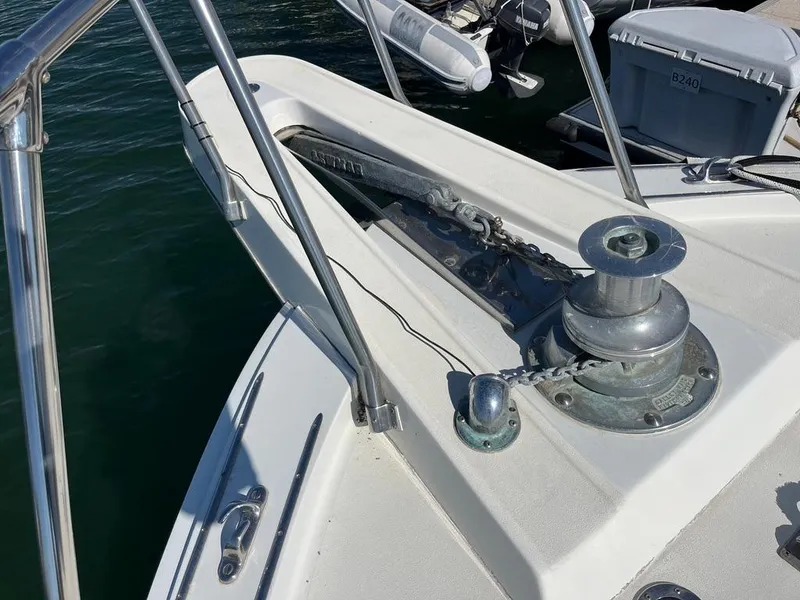 Slide: The Image of Bow of 1988 Hatteras 52 Convertible yacht with anchor and winch system. - 8