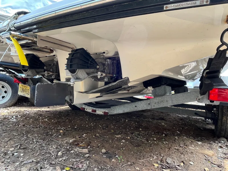 Slide: The Image of 2018 Yamaha Boats 212X on trailer, showing underside and jet propulsion system. - 12