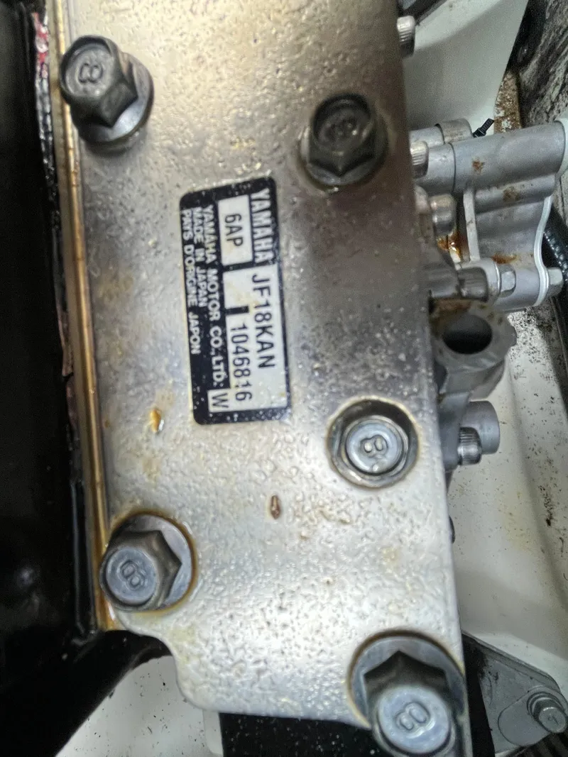 Slide: The Image of Close-up of Yamaha 212X 2018 engine part with visible serial number and bolts. - 28