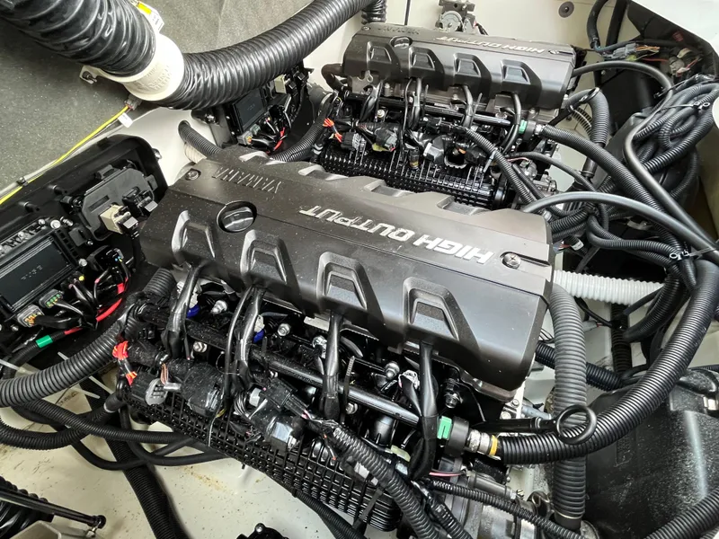 Slide: The Image of Engine compartment of a 2018 Yamaha Boats 212X, showcasing high-output engines and wiring. - 29