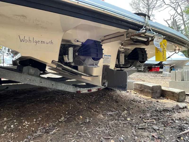 Slide: The Image of 2018 Yamaha Boats 212X on trailer, showing dual jet drives and hull details. - 8