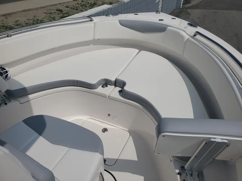 Slide: The Image of 2022 Robalo R222 Center Console boat interior with cushioned seating and sleek design. - 11