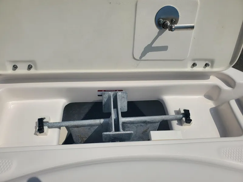 Slide: The Image of Open storage compartment of 2022 Robalo R222 Center Console boat. - 13