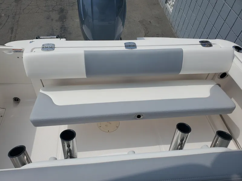 Slide: The Image of 2022 Robalo R222 Center Console boat seating and rod holders. - 6