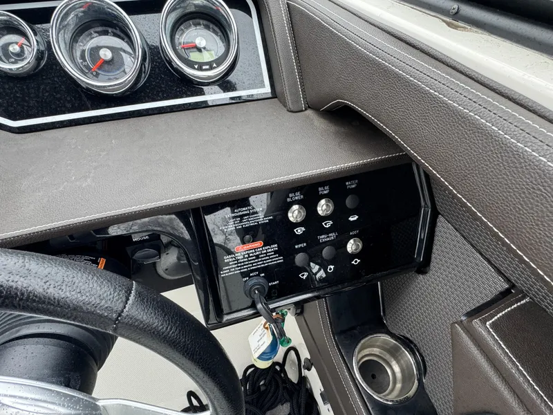 Slide: The Image of Dashboard of a 2017 Sea Ray SLX 230 boat with gauges and control panel. - 11