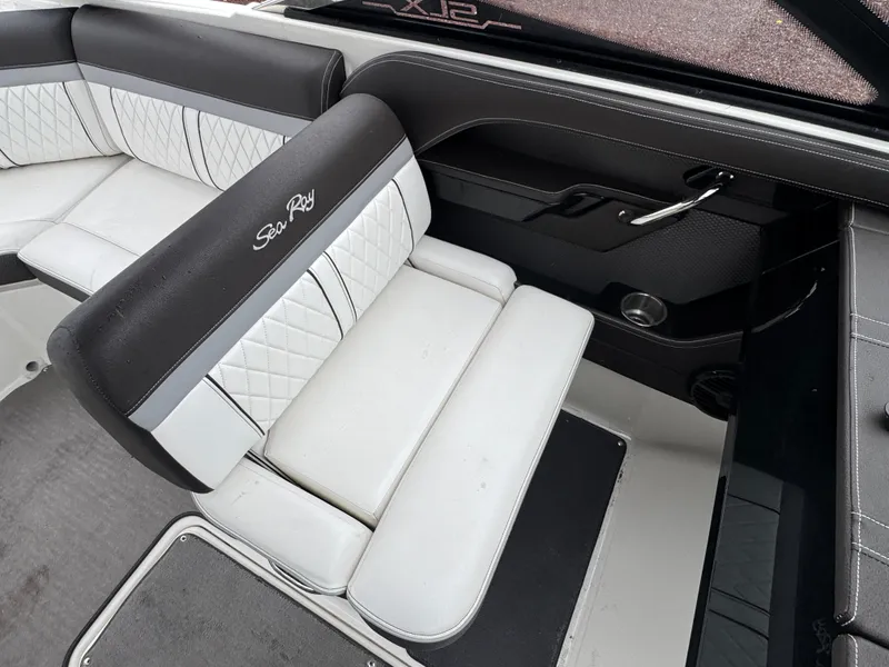 Slide: The Image of 2017 Sea Ray SLX 230 boat interior with white and black seating. - 12