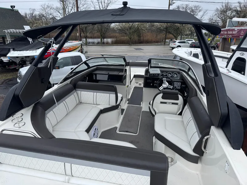 Slide: The Image of 2017 Sea Ray SLX 230 boat interior with luxurious seating and modern dashboard. - 3