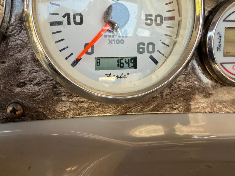 Slide: The Image of Close-up of a 2013 Stingray 235 CR boat tachometer showing 1649 RPM. - 11