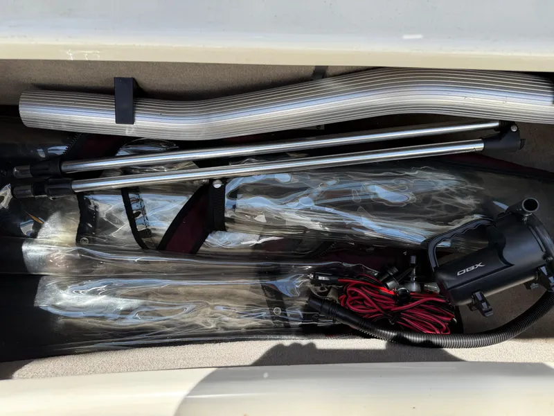 Slide: The Image of Storage compartment of a 2013 Stingray 235 CR boat with equipment and accessories. - 8