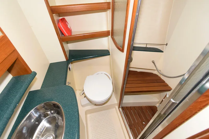 Slide: The Image of 2004 Hunter 44 Deck Salon bathroom with shower, sink, and toilet. - 22