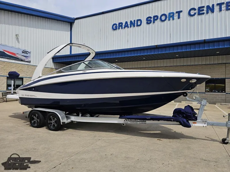 Slide: The Image of 2011 Regal 2500 Bowrider boat on trailer at Grand Sport Center. - 17
