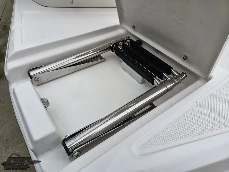 Slide: The Image of Stainless steel folding ladder on a 2011 Regal 2500 Bowrider boat. - 34