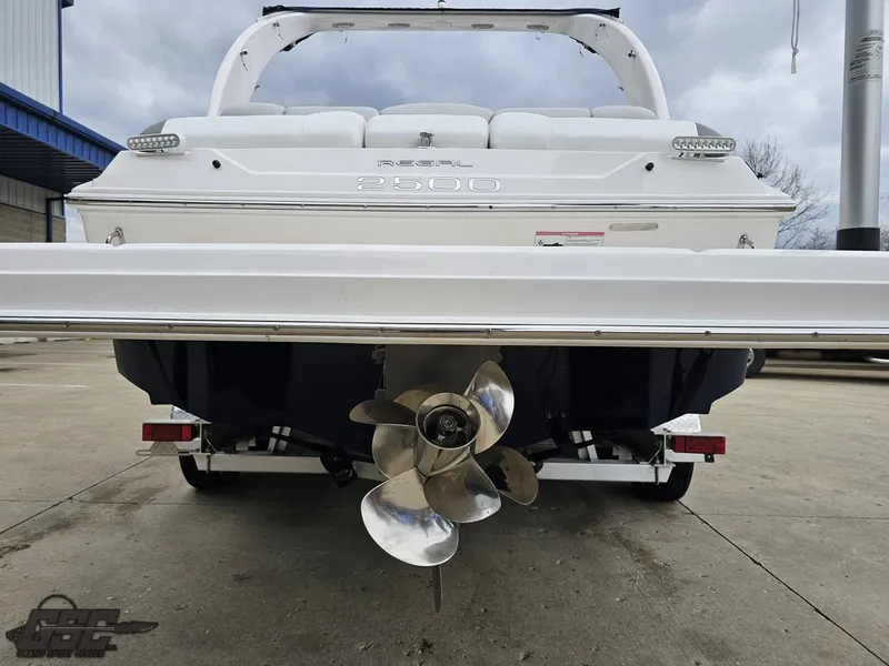 Slide: The Image of Rear view of a 2011 Regal 2500 Bowrider boat with visible propeller. - 37