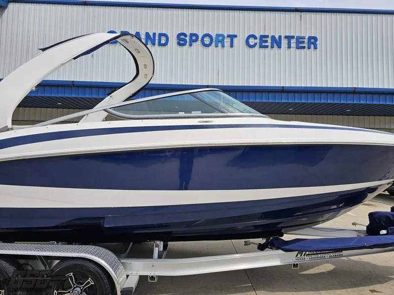 Slide: The Image of 2011 Regal 2500 Bowrider boat on trailer at Grand Sport Center. - 4