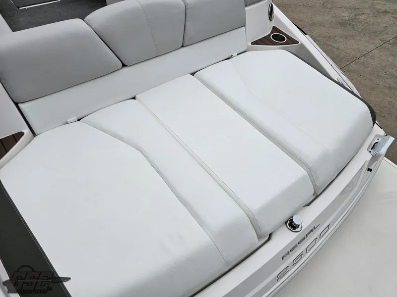 Slide: The Image of 2011 Regal 2500 Bowrider boat with white cushioned seating and cup holders. - 42