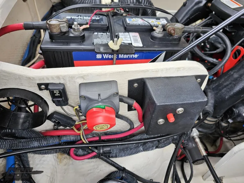 Slide: The Image of Engine compartment of a 2011 Regal 2500 Bowrider with West Marine battery and wiring. - 47
