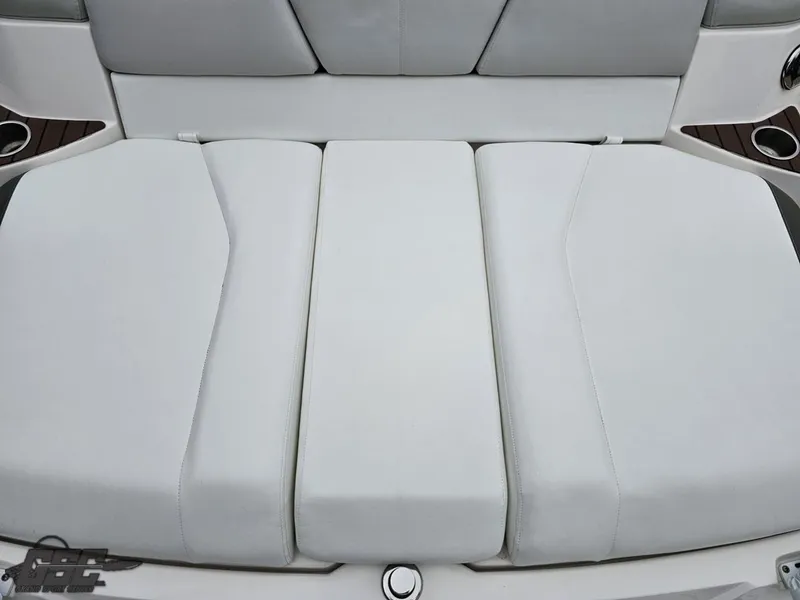Slide: The Image of 2011 Regal 2500 Bowrider boat seat, featuring white cushioned upholstery. - 48