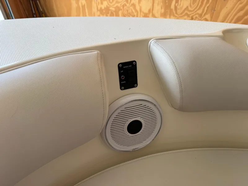 Slide: The Image of Interior of 2012 Edgewater 245 CX boat with speaker and control panel. - 17