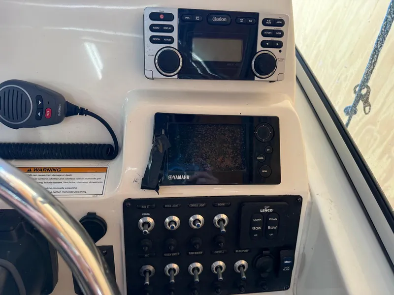 Slide: The Image of Control panel of a 2012 Edgewater 245 CX boat with Yamaha electronics and Clarion audio system. - 22