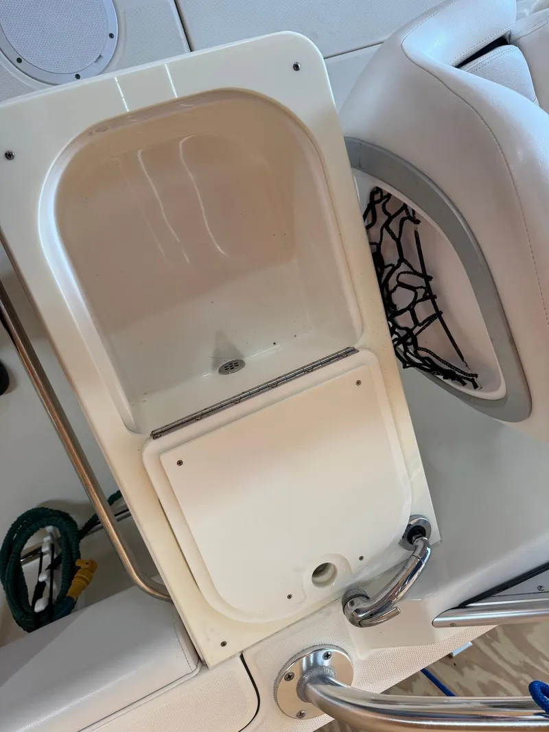 Slide: The Image of Edgewater 245 CX 2012 boat interior with sink and seating area. - 27